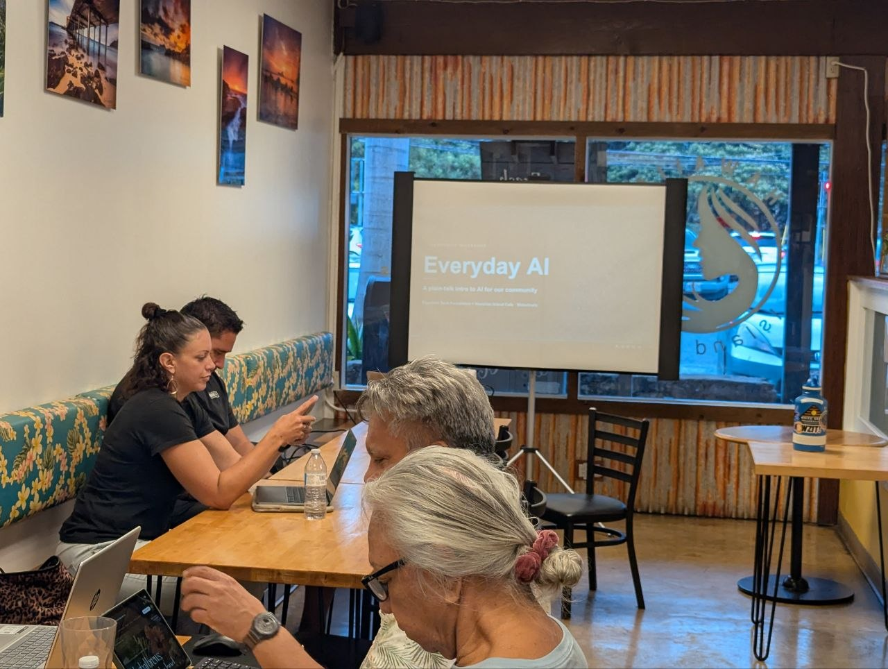 Participants working on laptops at an Everyday AI workshop