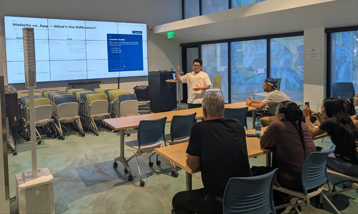 Instructor presenting “Website vs. App” to workshop participants
